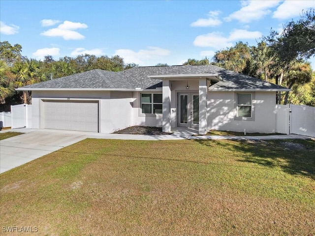 view of front facade featuring a garage and a front lawn