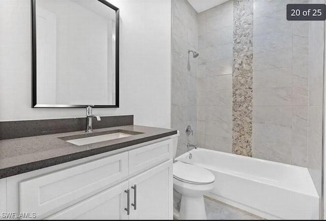 full bathroom with vanity, toilet, and tiled shower / bath