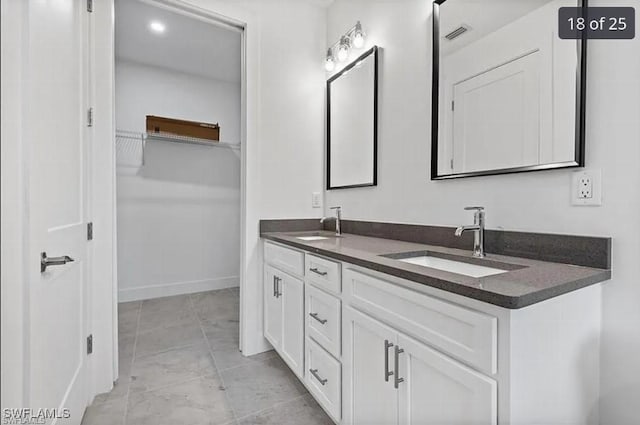 bathroom featuring tile patterned floors and vanity