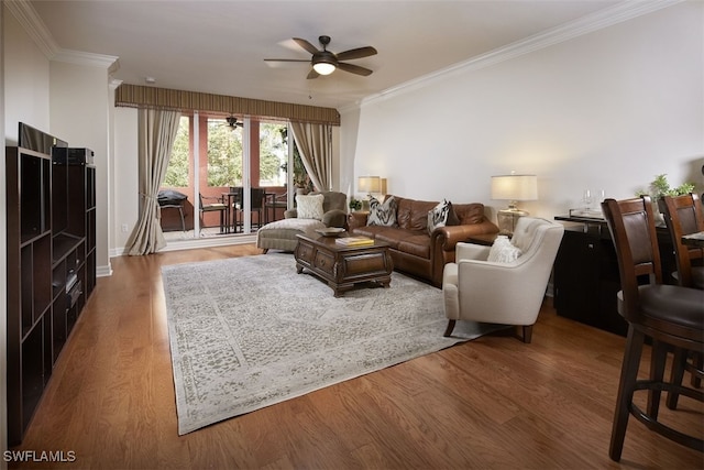 living room featuring hardwood / wood-style flooring, ceiling fan, and ornamental molding