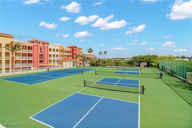 view of tennis court with basketball hoop