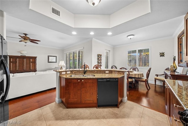 kitchen with light tile patterned floors, black dishwasher, ceiling fan, and sink