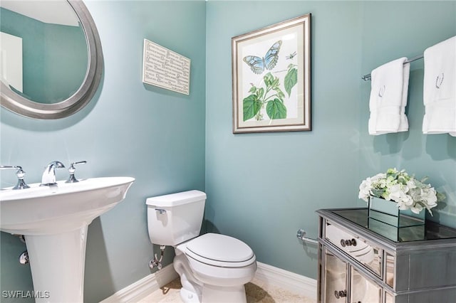 bathroom featuring sink and toilet