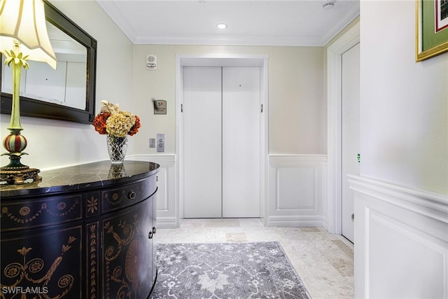 interior space with elevator and ornamental molding