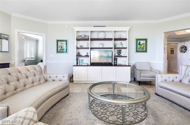 living room with ornamental molding