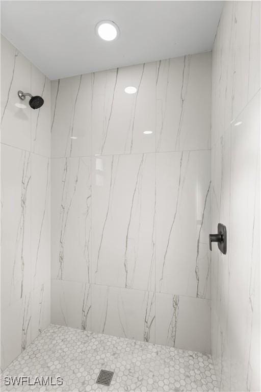 bathroom with tiled shower