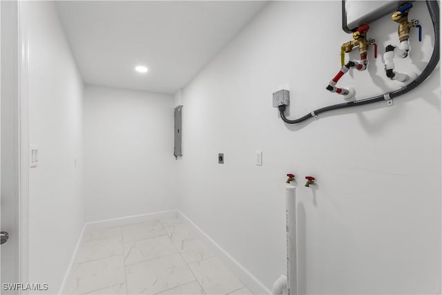 clothes washing area featuring electric panel, hookup for a washing machine, and hookup for an electric dryer