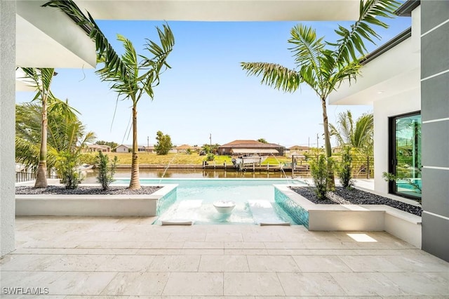 view of swimming pool with pool water feature