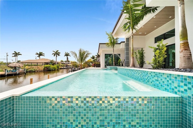 view of swimming pool with a water view