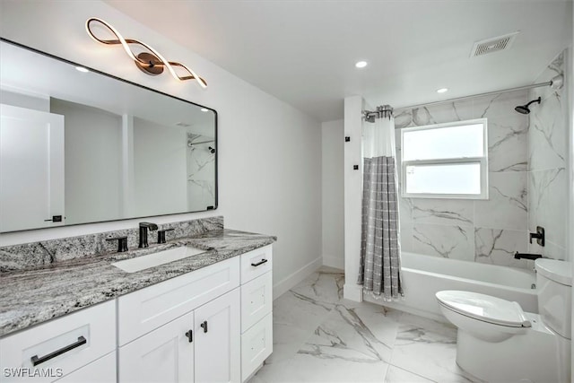 full bathroom featuring shower / bath combo with shower curtain, vanity, and toilet