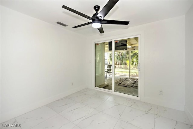 spare room with ceiling fan