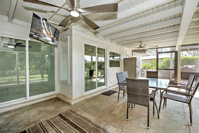 sunroom featuring beam ceiling