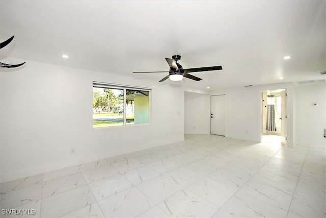 spare room featuring ceiling fan