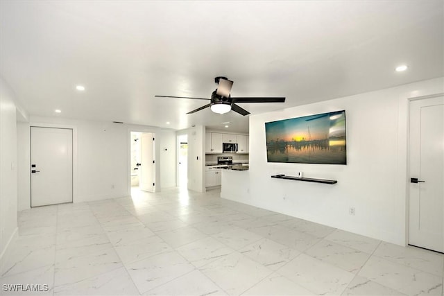 unfurnished living room featuring ceiling fan