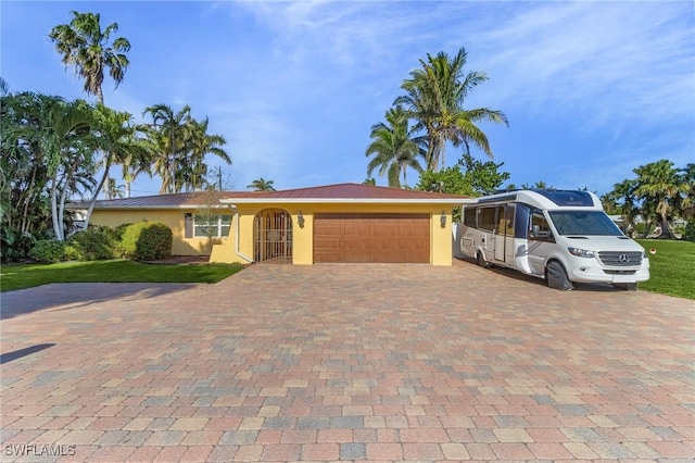 view of front facade featuring a front yard and a garage