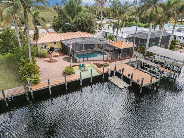 dock area featuring a water view, a patio, and a pool with hot tub