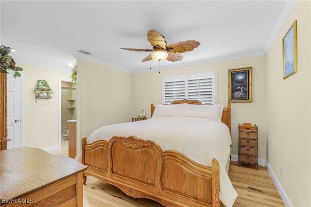 bedroom featuring crown molding, ceiling fan, light hardwood / wood-style flooring, and ensuite bathroom