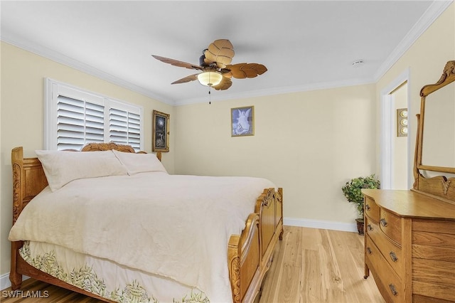 bedroom featuring ceiling fan, ornamental molding, and light hardwood / wood-style flooring