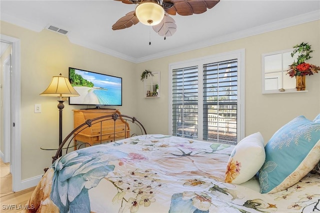 bedroom featuring ceiling fan and crown molding