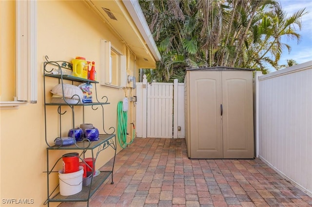 view of patio with a shed