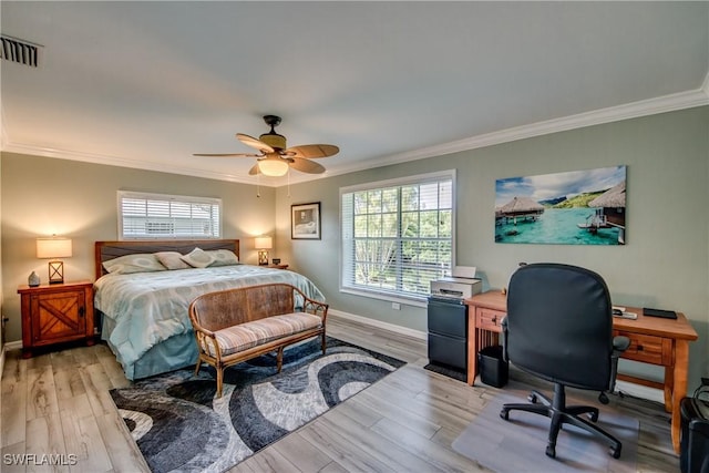 bedroom with ceiling fan, light wood-type flooring, and ornamental molding