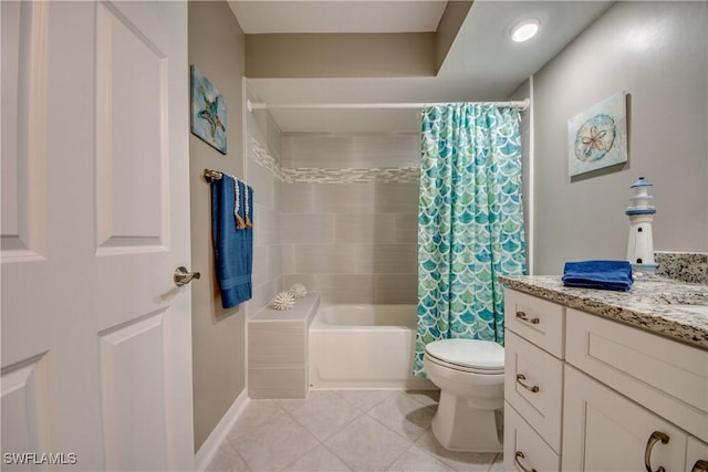 full bathroom featuring tile patterned flooring, vanity, toilet, and shower / tub combo with curtain