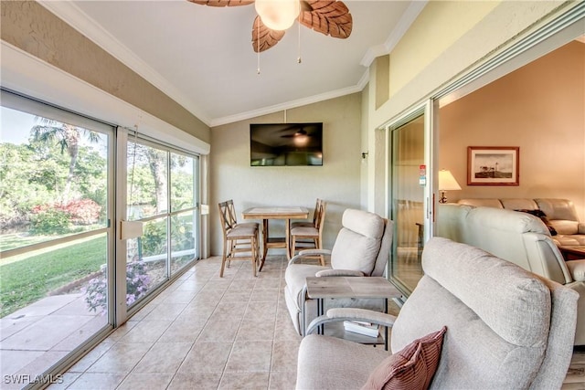 sunroom / solarium featuring ceiling fan and vaulted ceiling