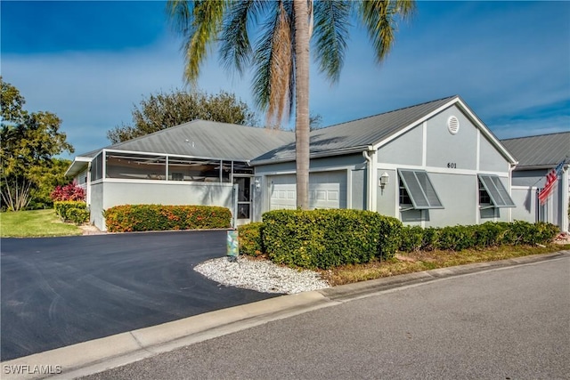 15381 River Vista Dr Unit 601, North Fort Myers, FL 33917 - view of front facade featuring a garage