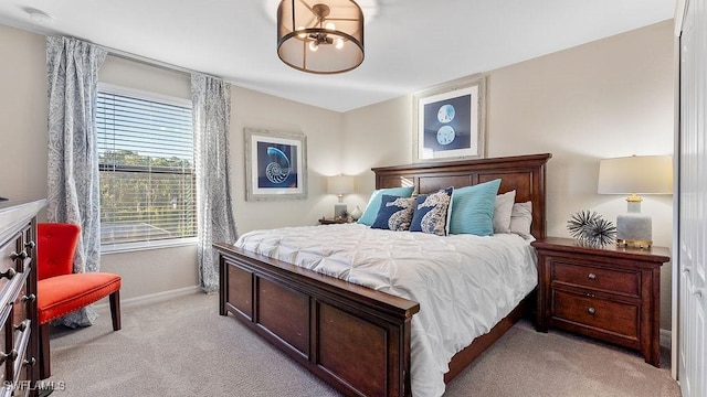 bedroom featuring light carpet