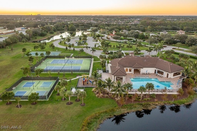 aerial view at dusk with a water view