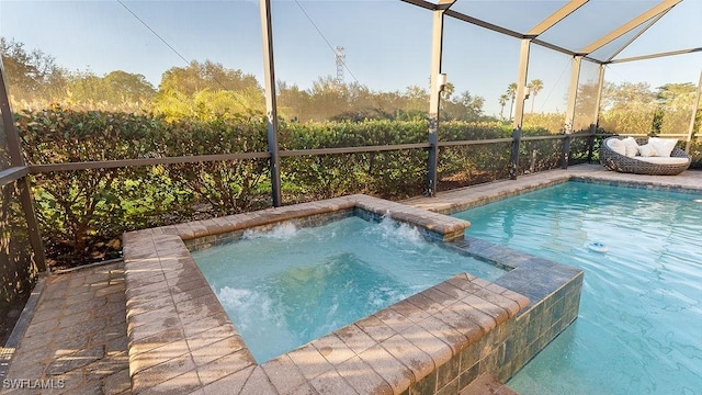 view of swimming pool with an in ground hot tub and glass enclosure