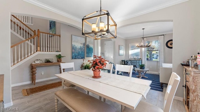 dining room with an inviting chandelier and crown molding