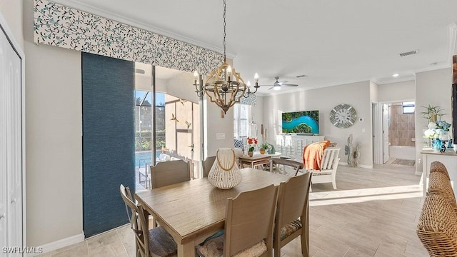 dining room with ceiling fan with notable chandelier, light hardwood / wood-style flooring, and crown molding