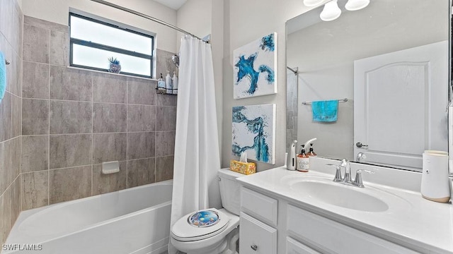 full bathroom featuring vanity, shower / tub combo, and toilet