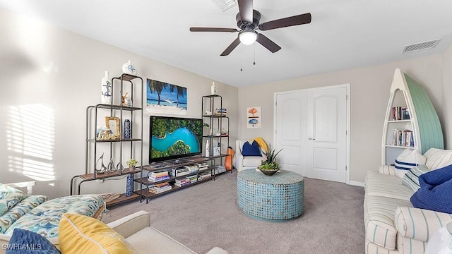 carpeted living room featuring ceiling fan