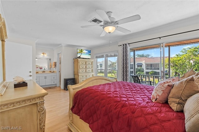 bedroom featuring ceiling fan, crown molding, ensuite bathroom, light hardwood / wood-style floors, and access to outside