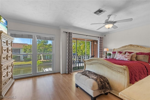 bedroom featuring access to exterior, ceiling fan, crown molding, and light wood-type flooring