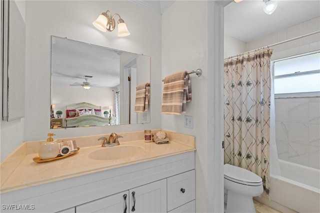 full bathroom featuring ceiling fan, shower / tub combo with curtain, vanity, and toilet