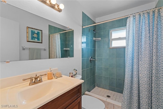 bathroom with vanity, toilet, and walk in shower