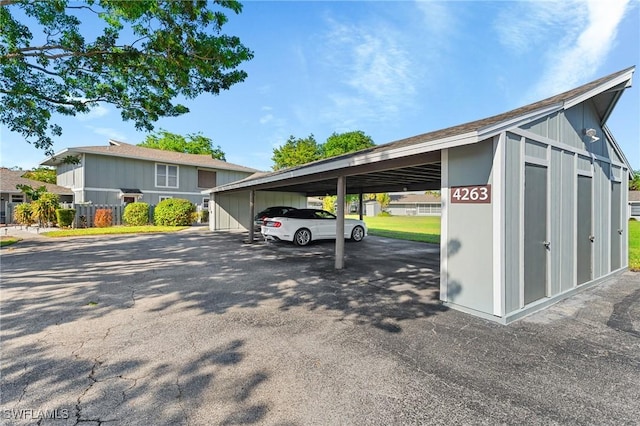 view of vehicle parking featuring a carport