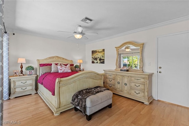 bedroom with light wood-type flooring, ceiling fan, and crown molding