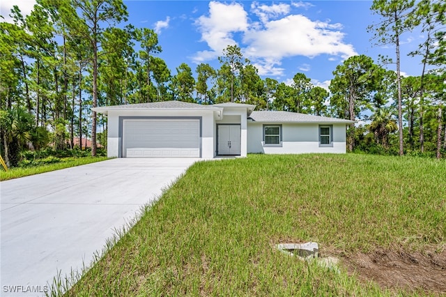 ranch-style home with a garage and a front lawn