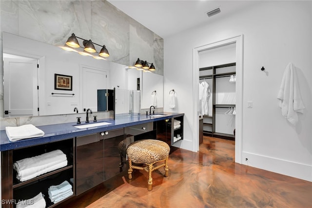 bathroom featuring vanity and concrete floors