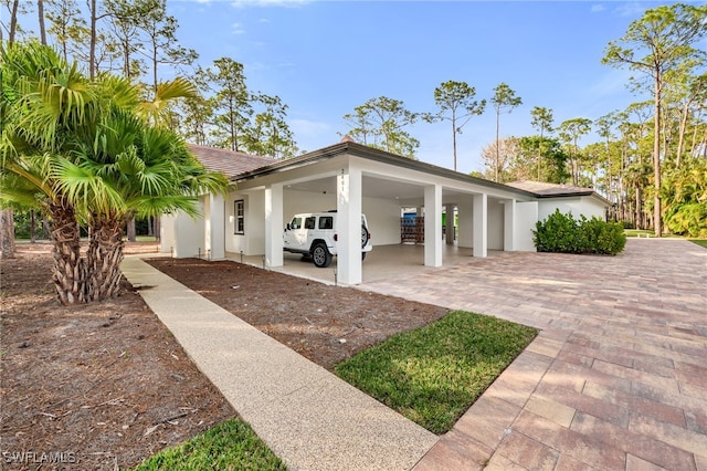 view of home's exterior with a carport