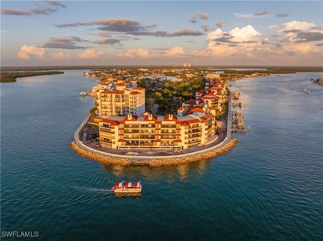 aerial view at dusk with a water view