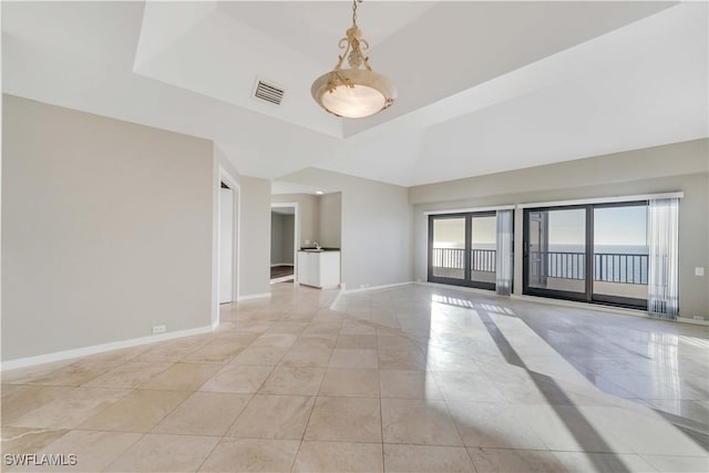 empty room with a tray ceiling