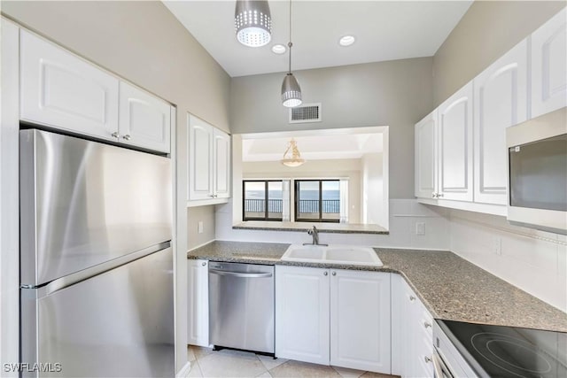 kitchen with white cabinets, sink, and stainless steel appliances