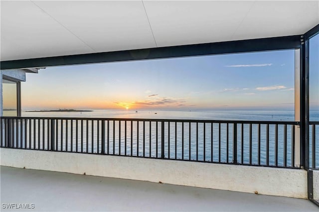 balcony at dusk with a water view