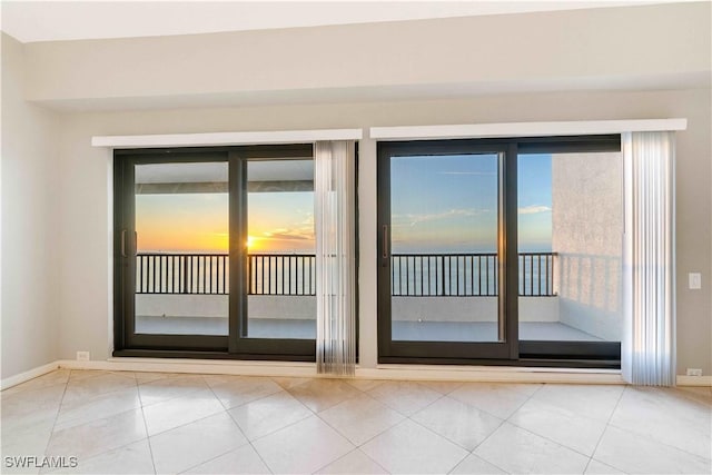 doorway featuring light tile patterned floors