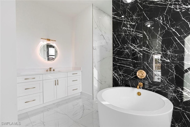 bathroom featuring vanity and a tub to relax in